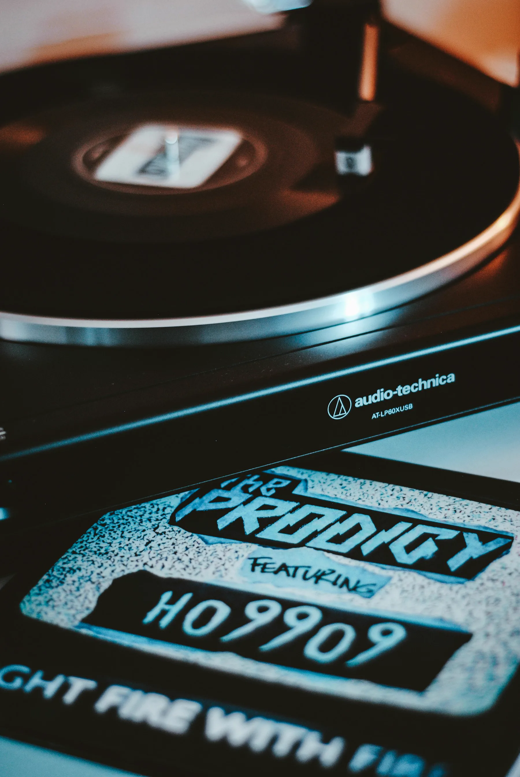 A black vinyl record on a turntable